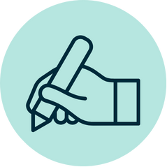 Hand holding a pen writing copy